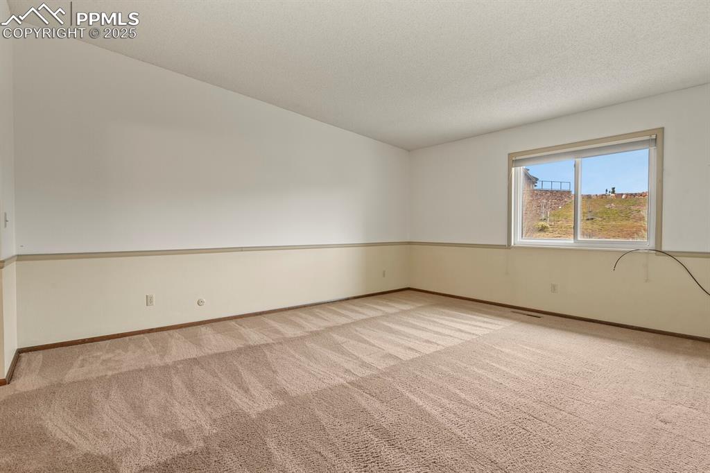 1122 Fontmore Road, Unit C Colorado Springs, CO 80904 - Photo 16 of 31 an empty room with a window