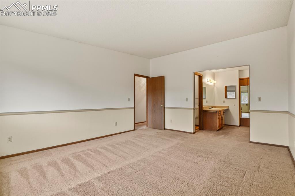 1122 Fontmore Road, Unit C Colorado Springs, CO 80904 - Photo 17 of 31 a view of an empty room with a kitchen