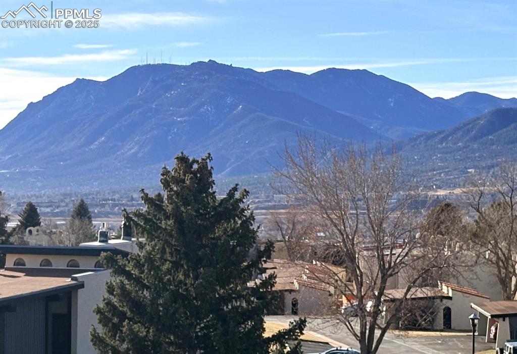 1122 Fontmore Road, Unit C Colorado Springs, CO 80904 - Photo 3 of 31 a view of a house with a mountain in the background
