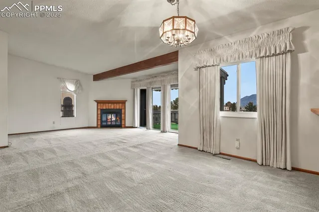 a bathroom with a granite countertop sink a mirror and a bathtub