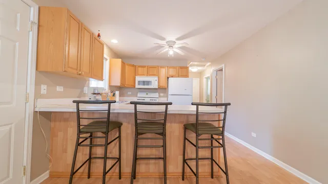 a kitchen with a stove microwave and refrigerator