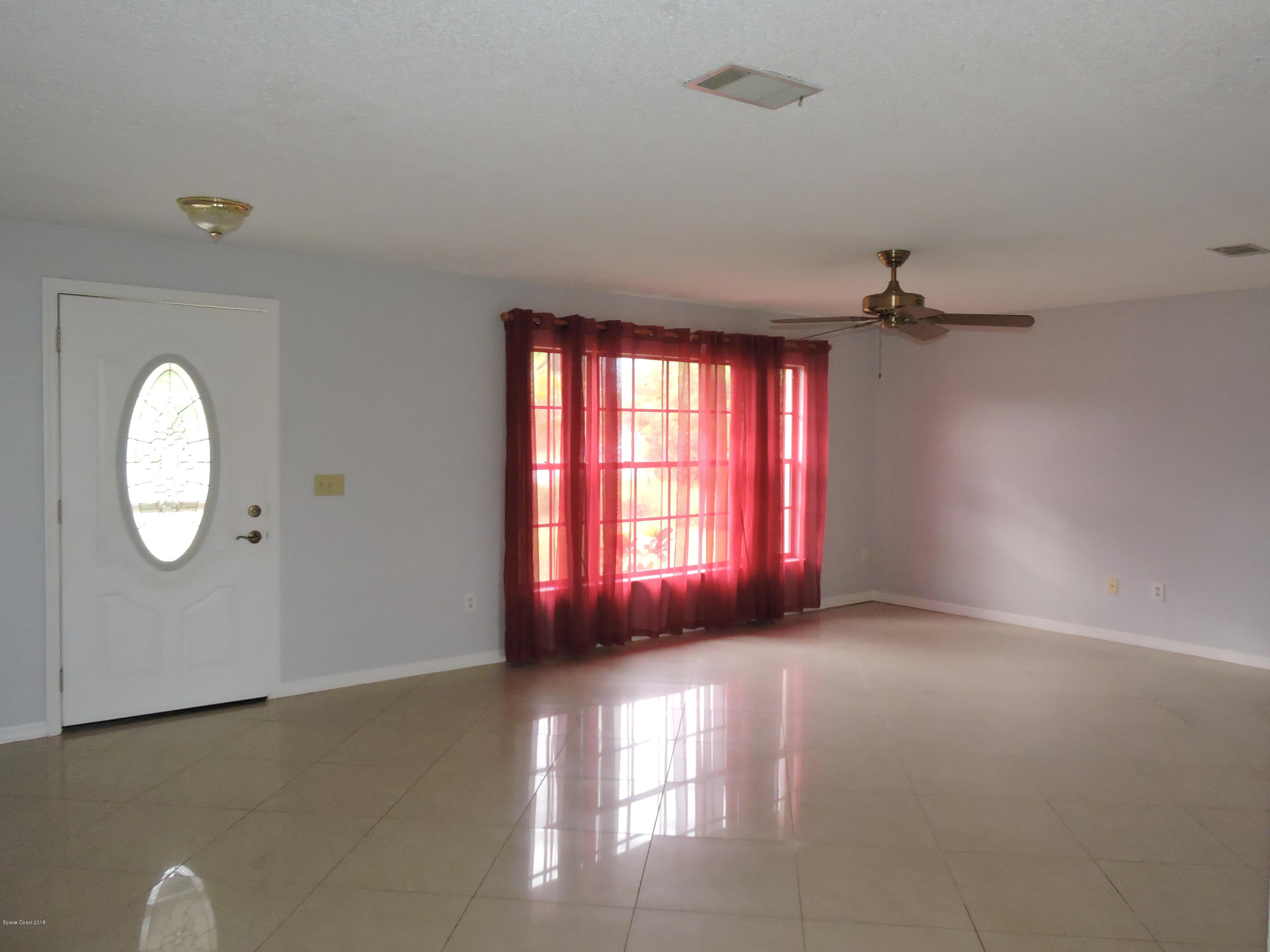 445 Avocado Road Northwest Palm Bay, FL 32907 - Photo 2 of 12 family room
