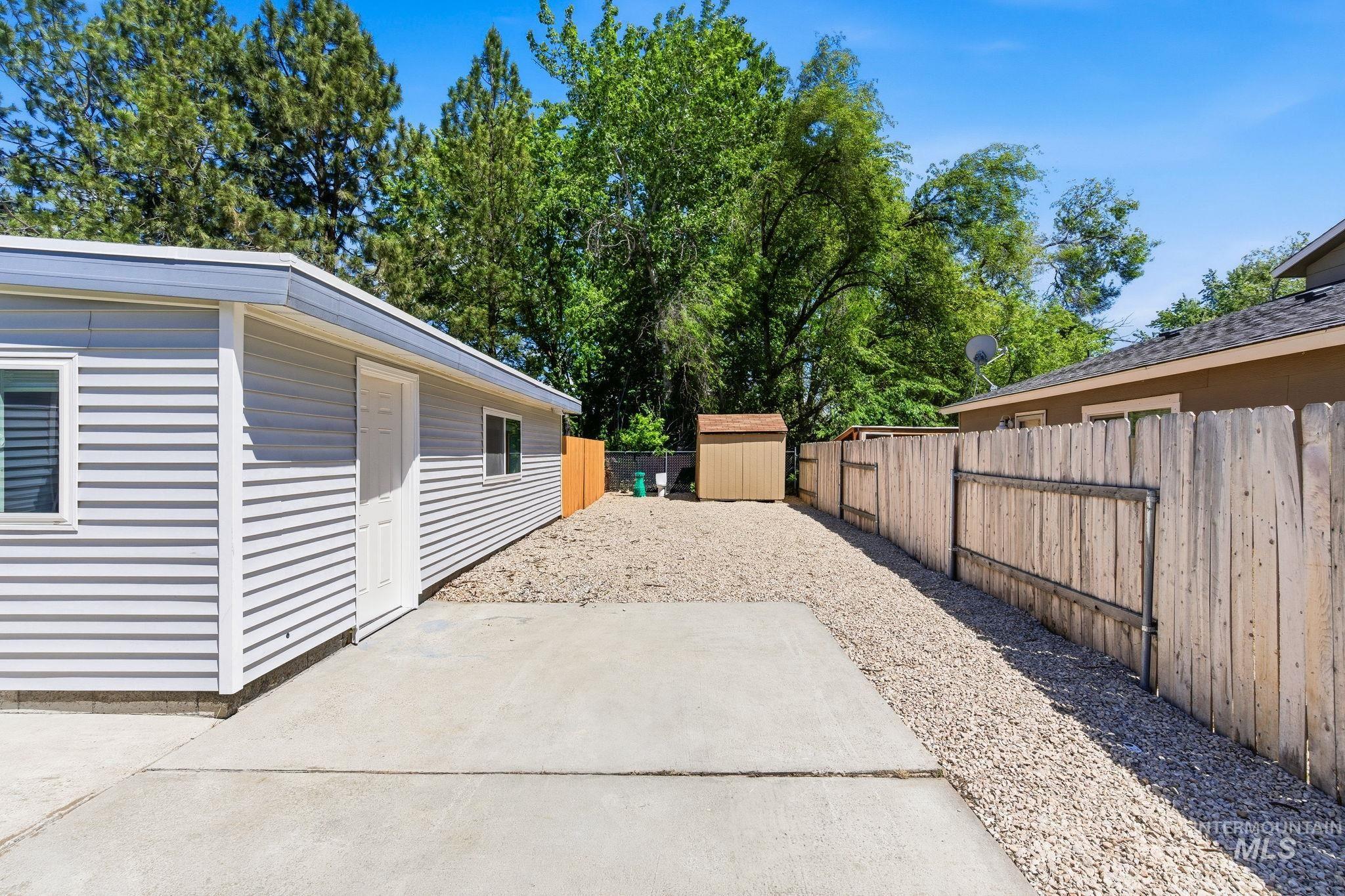 2224 Rachel Circle Boise, ID 83706 - Photo 40 of 50 Exterior featuring light gray horizontal siding, white trim, and a concrete patio