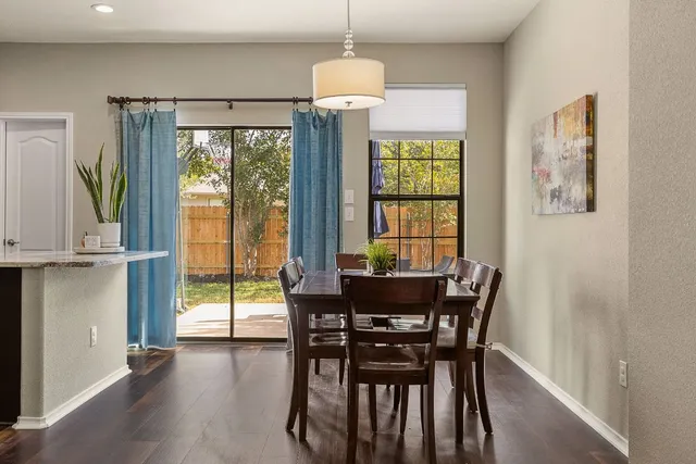 a dining room with furniture and window