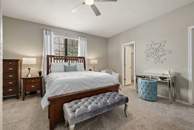 a bedroom with a bed furniture and window