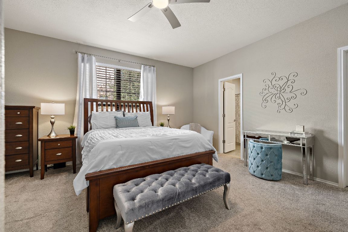 408 Tyree Road Cedar Park, TX 78613 - Photo 15 of 25 a bedroom with a bed furniture and window