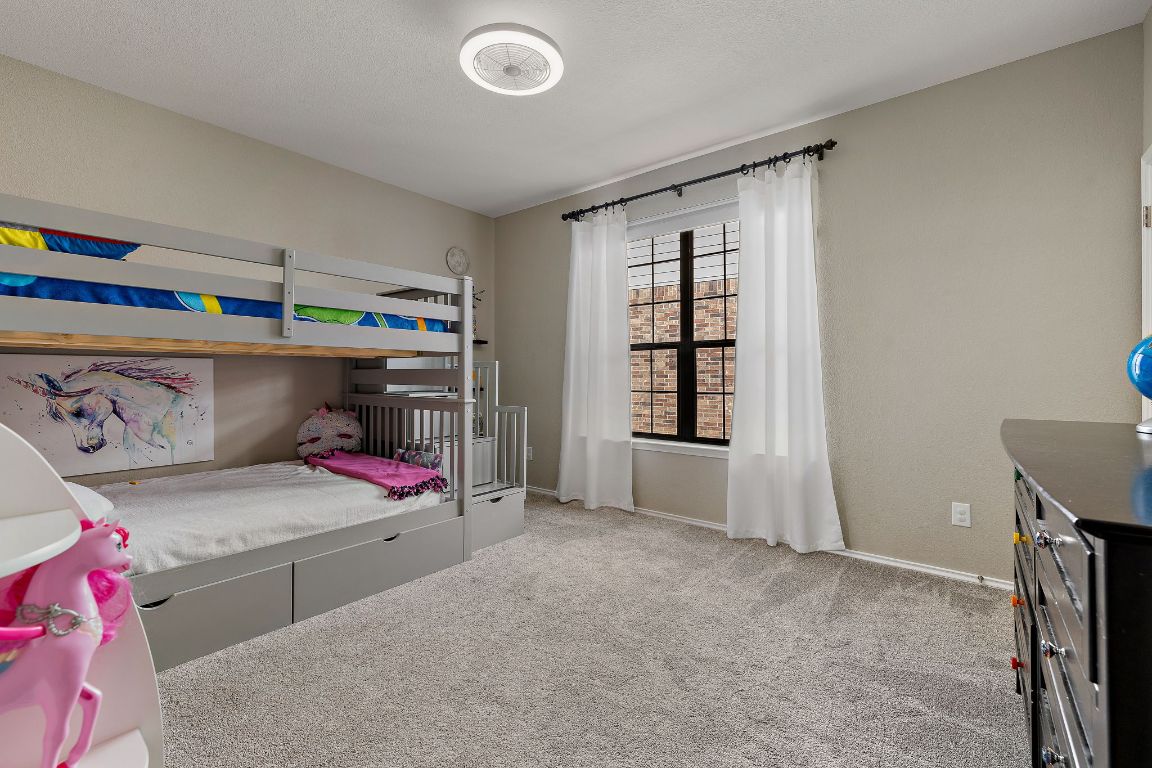 408 Tyree Road Cedar Park, TX 78613 - Photo 18 of 25 a bedroom with a bed and window