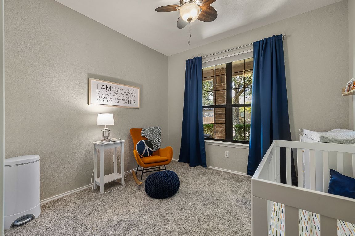 408 Tyree Road Cedar Park, TX 78613 - Photo 19 of 25 a view of a workspace with furniture and a window