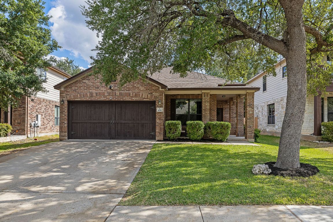 408 Tyree Road Cedar Park, TX 78613 - Photo 2 of 25 a front view of a house with a yard and garage