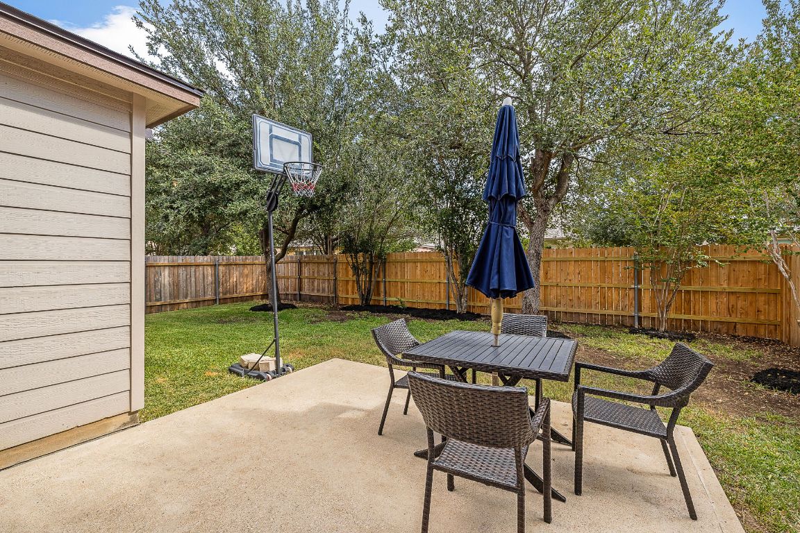 408 Tyree Road Cedar Park, TX 78613 - Photo 22 of 25 a patio with a table and chairs and potted plants