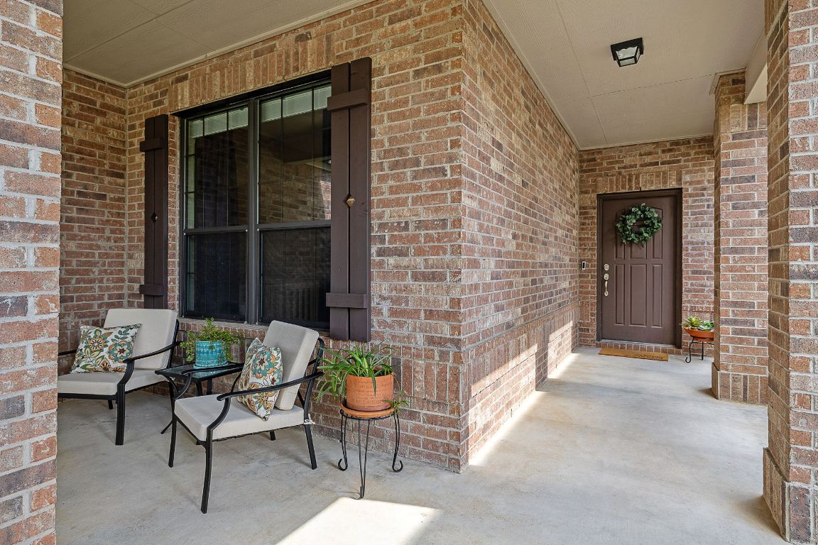 408 Tyree Road Cedar Park, TX 78613 - Photo 4 of 25 a porch with a table and chairs