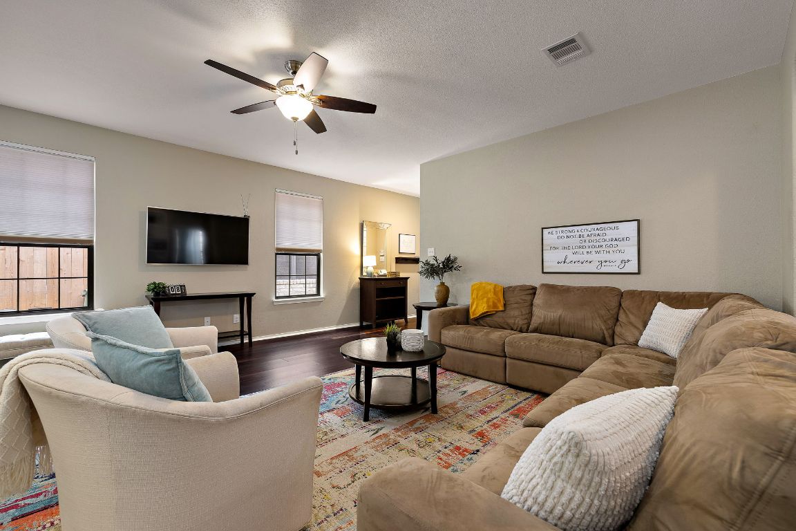408 Tyree Road Cedar Park, TX 78613 - Photo 7 of 25 a living room with furniture and a flat screen tv