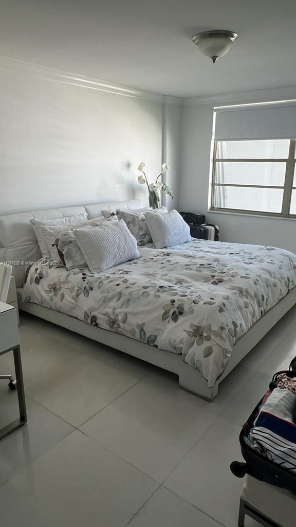 199 Ocean Ln Drive, Unit 1206 Key Biscayne, FL 33149 - Photo 12 of 12 a bedroom with a bed and window