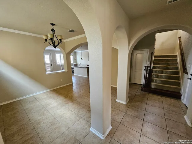 a view of a hallway view with wooden floor and staircase