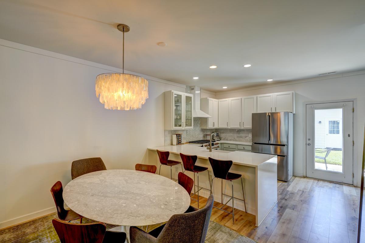 20017 Roark Hoey Loop Chapel Hill, NC 27517 - Photo 16 of 44 a very nice looking dining room with furniture window and wooden floor