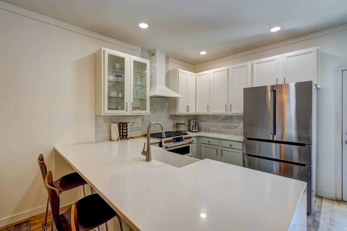 20017 Roark Hoey Loop Chapel Hill, NC 27517 - Photo 18 of 44 a kitchen with a stove a refrigerator and a sink