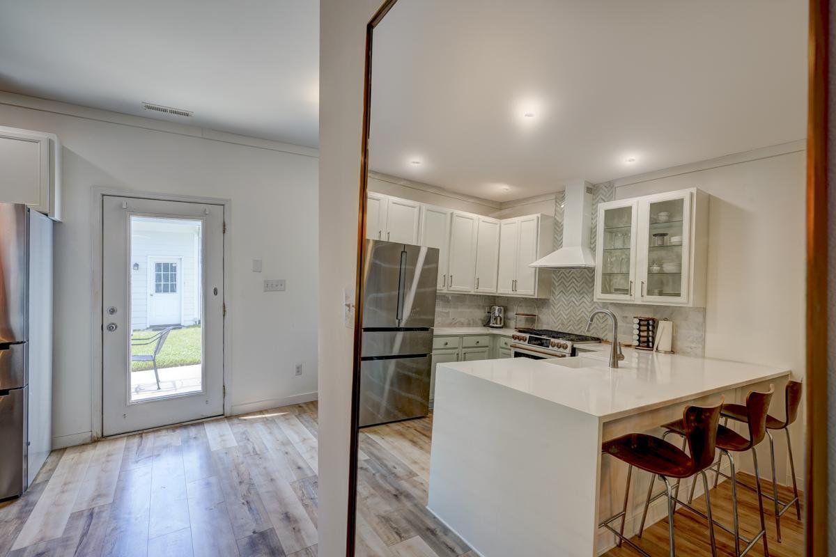 20017 Roark Hoey Loop Chapel Hill, NC 27517 - Photo 20 of 44 a kitchen with kitchen island a sink appliances and cabinets