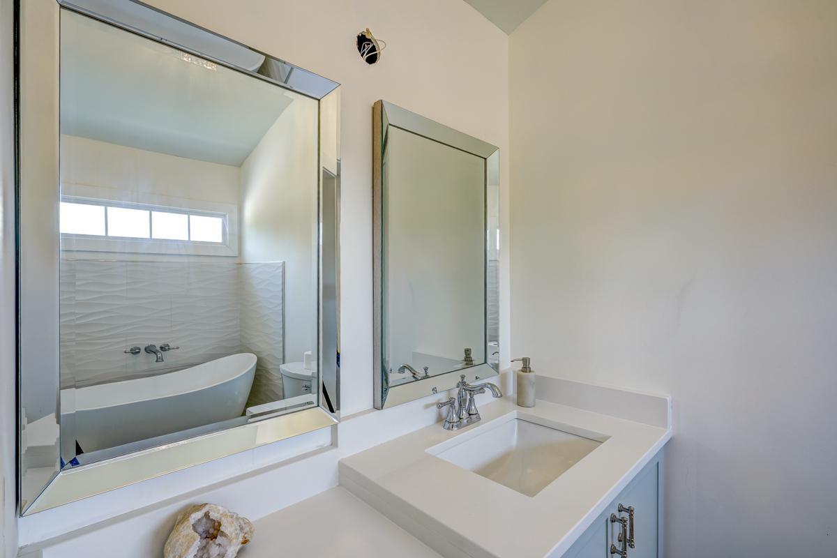 20017 Roark Hoey Loop Chapel Hill, NC 27517 - Photo 22 of 44 a bathroom with a sink and a mirror