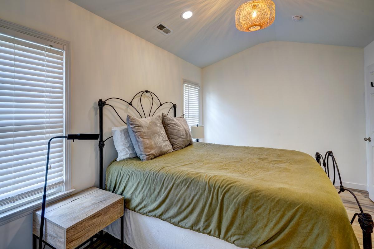 20017 Roark Hoey Loop Chapel Hill, NC 27517 - Photo 29 of 44 a bedroom with a bed and wooden floor