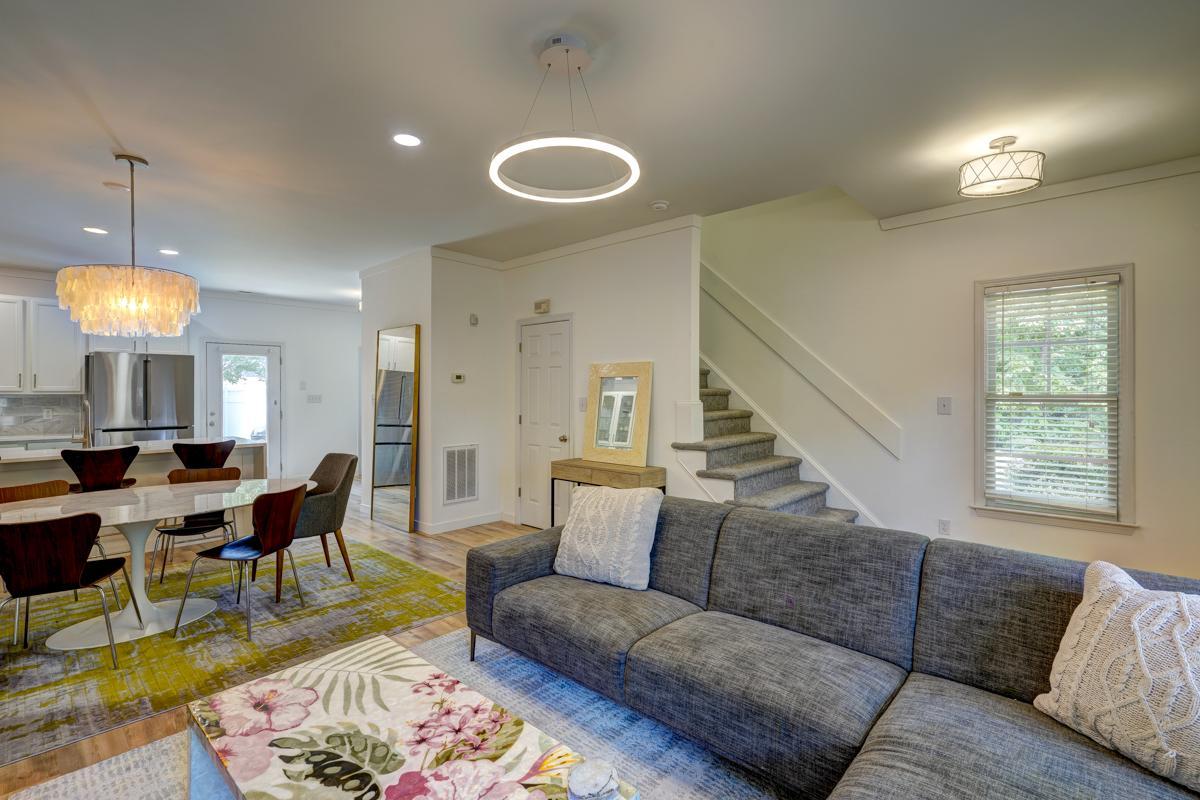 20017 Roark Hoey Loop Chapel Hill, NC 27517 - Photo 3 of 44 a living room with furniture and a chandelier