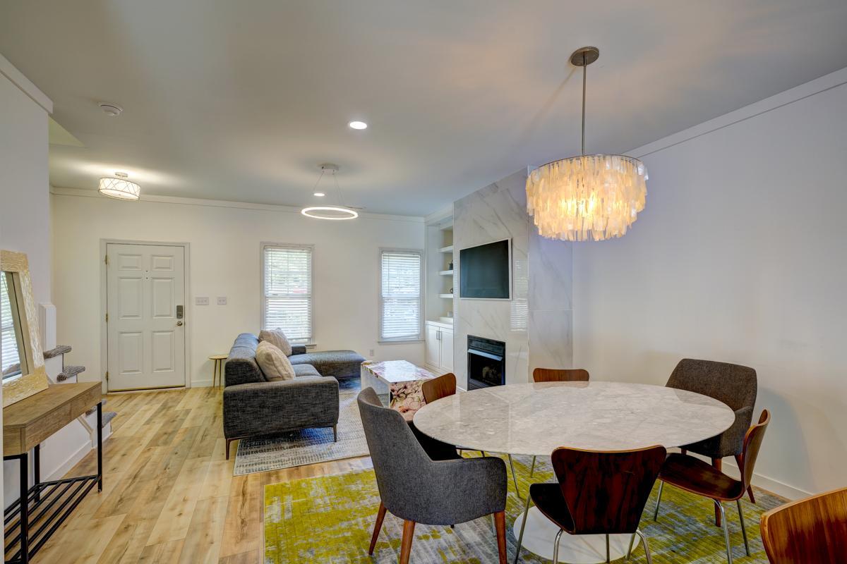 20017 Roark Hoey Loop Chapel Hill, NC 27517 - Photo 5 of 44 a view of a dining room with furniture wooden floor chandelier