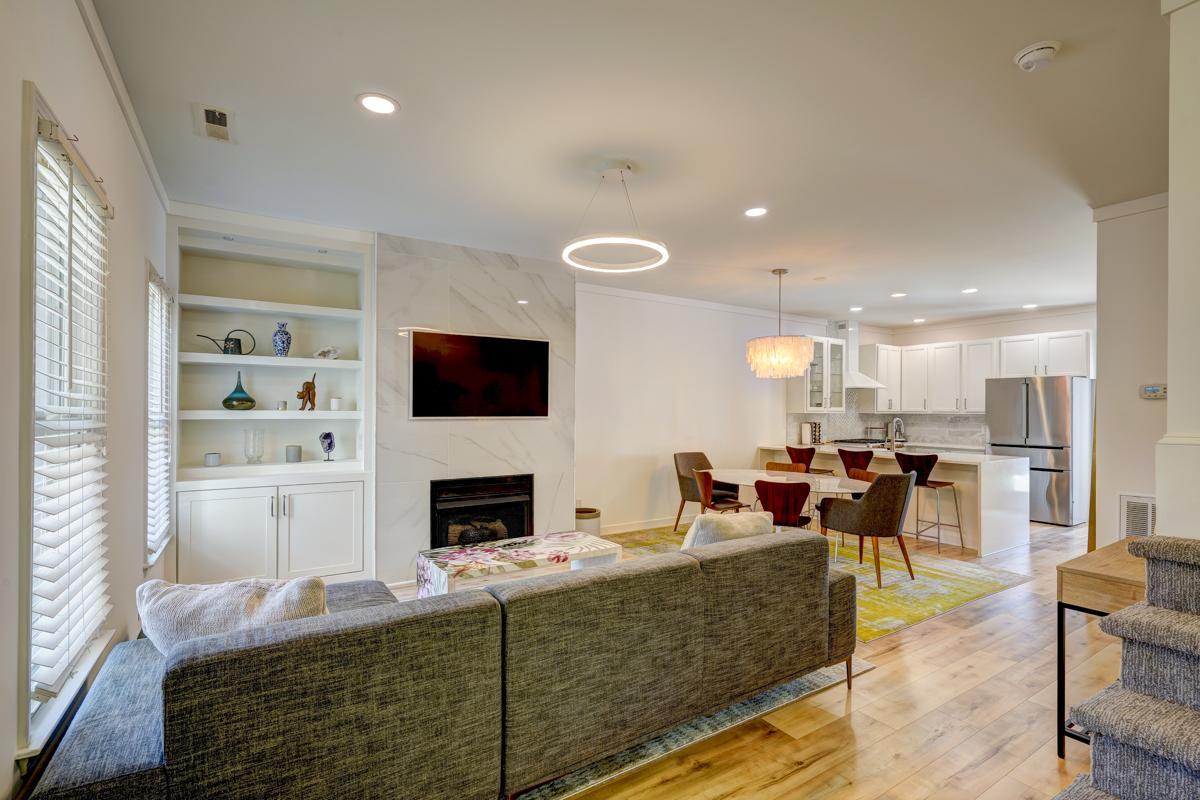 20017 Roark Hoey Loop Chapel Hill, NC 27517 - Photo 9 of 44 a living room with fireplace furniture and a flat screen tv