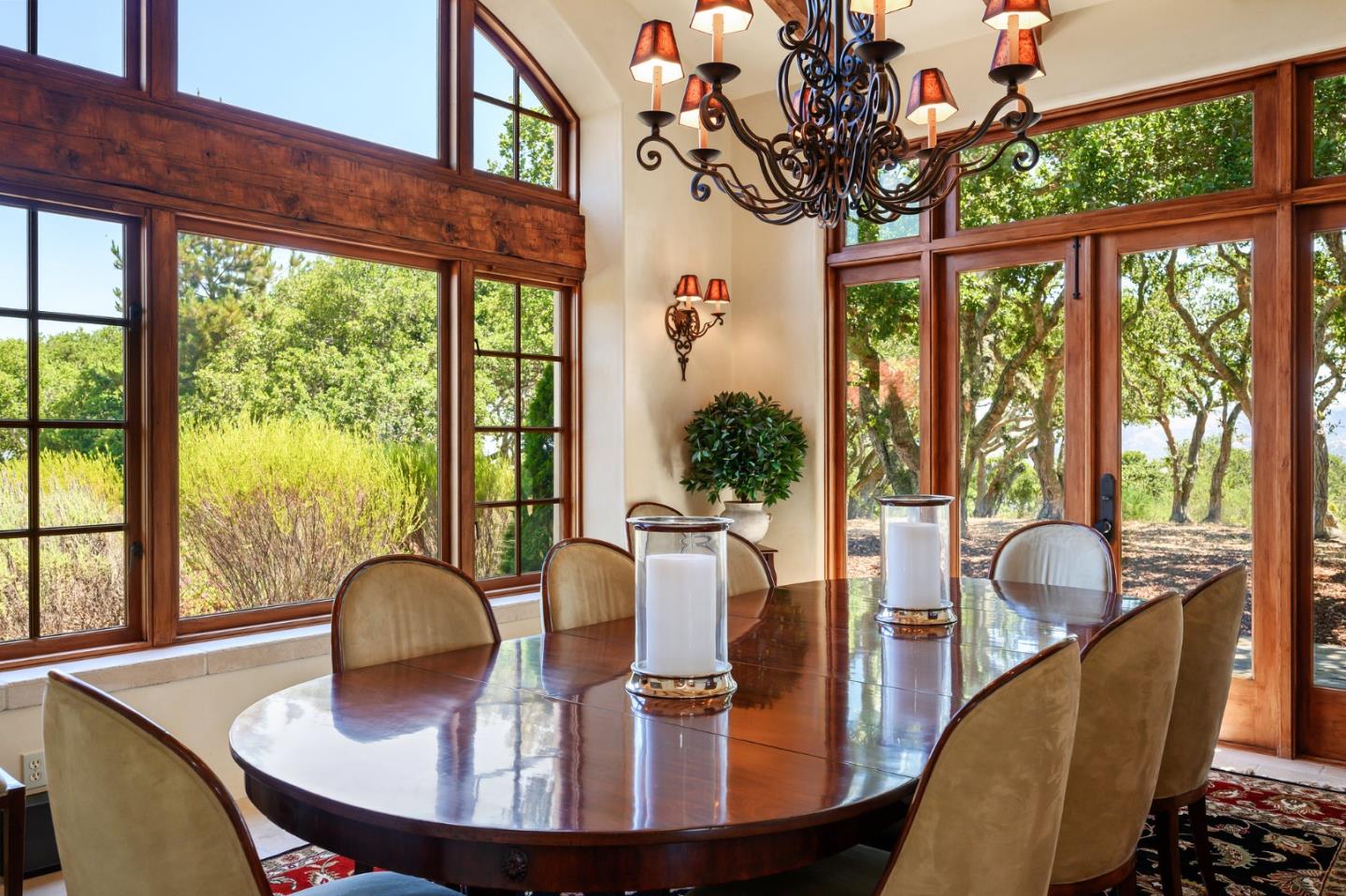 960 Laureles Grade Carmel Valley, CA 93924 - Photo 11 of 76 a dining room with furniture a chandelier and wooden floor