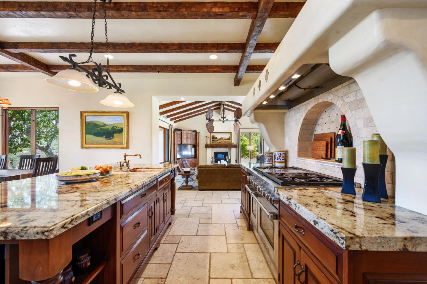 960 Laureles Grade Carmel Valley, CA 93924 - Photo 16 of 76 a large kitchen with stainless steel appliances granite countertop a sink and a stove