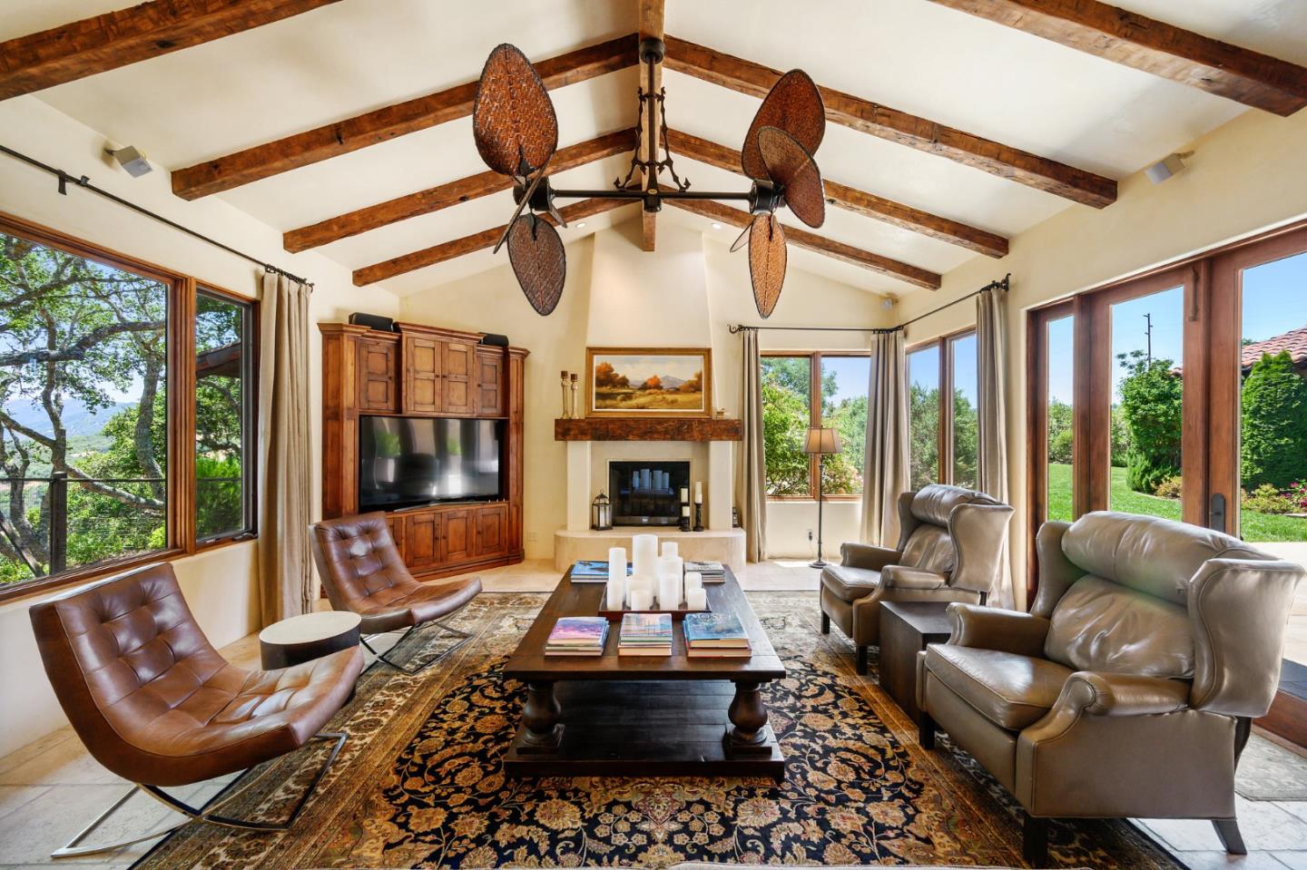 960 Laureles Grade Carmel Valley, CA 93924 - Photo 21 of 76 a living room with furniture fireplace and large windows