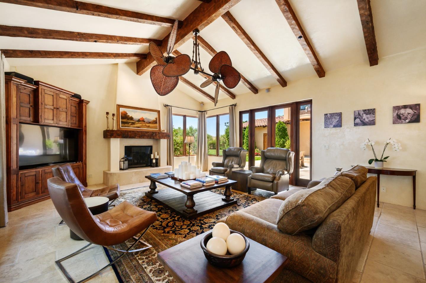 960 Laureles Grade Carmel Valley, CA 93924 - Photo 23 of 76 a living room with furniture a fireplace and lots of windows