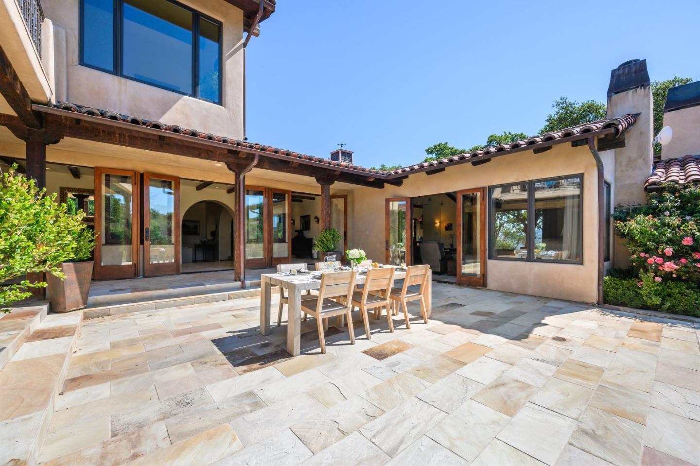 960 Laureles Grade Carmel Valley, CA 93924 - Photo 25 of 76 a view of a patio with table and chairs and potted plants