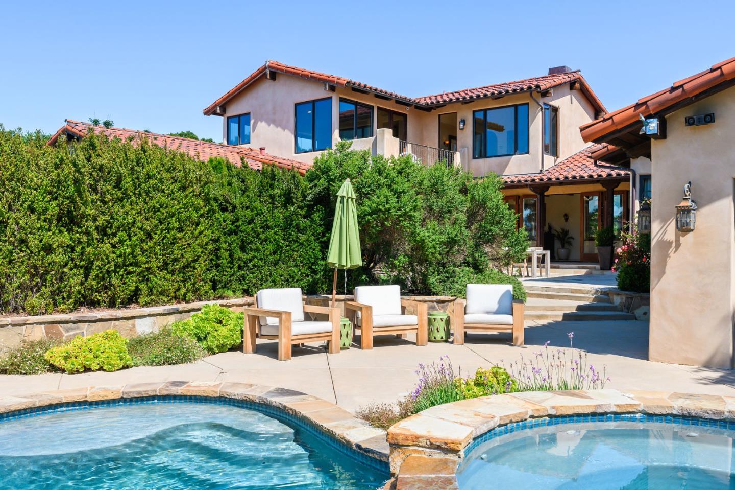 960 Laureles Grade Carmel Valley, CA 93924 - Photo 35 of 76 a view of a house with backyard and sitting area