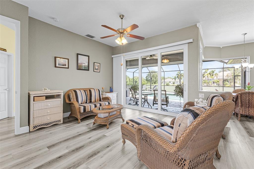 7130 Scarlet Sage Court Punta Gorda, FL 33955 - Photo 11 of 26 a living room with furniture and a large window