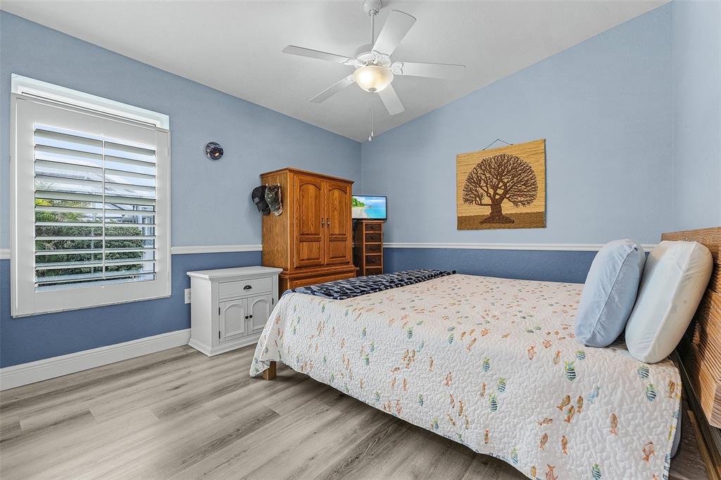 7130 Scarlet Sage Court Punta Gorda, FL 33955 - Photo 17 of 26 a bedroom with a bed dresser and a window