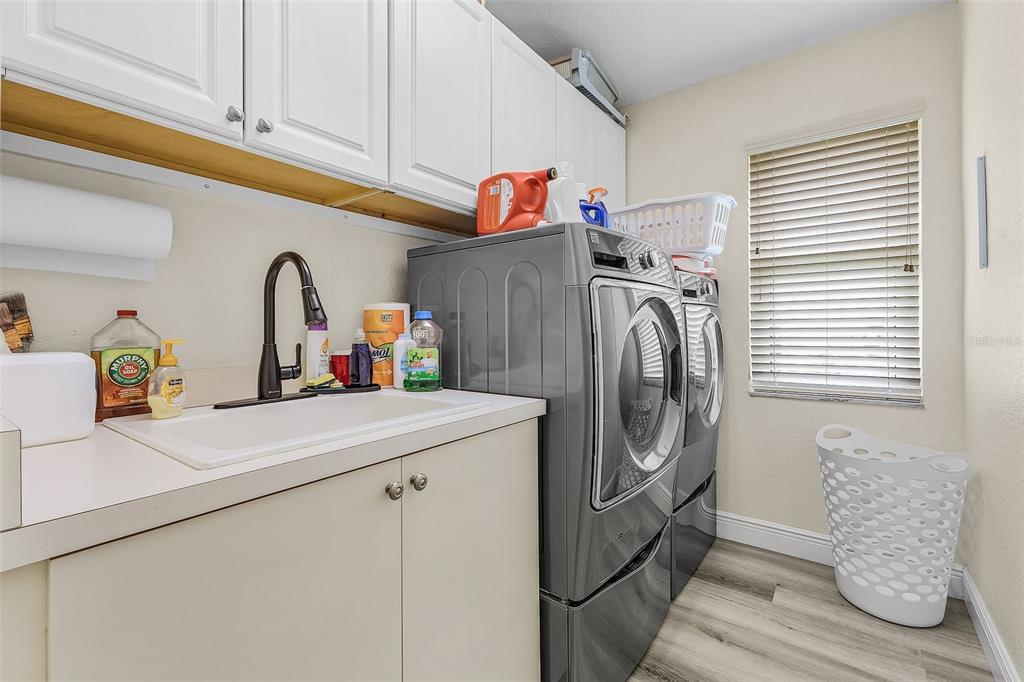 7130 Scarlet Sage Court Punta Gorda, FL 33955 - Photo 20 of 26 a utility room with dryer and washer