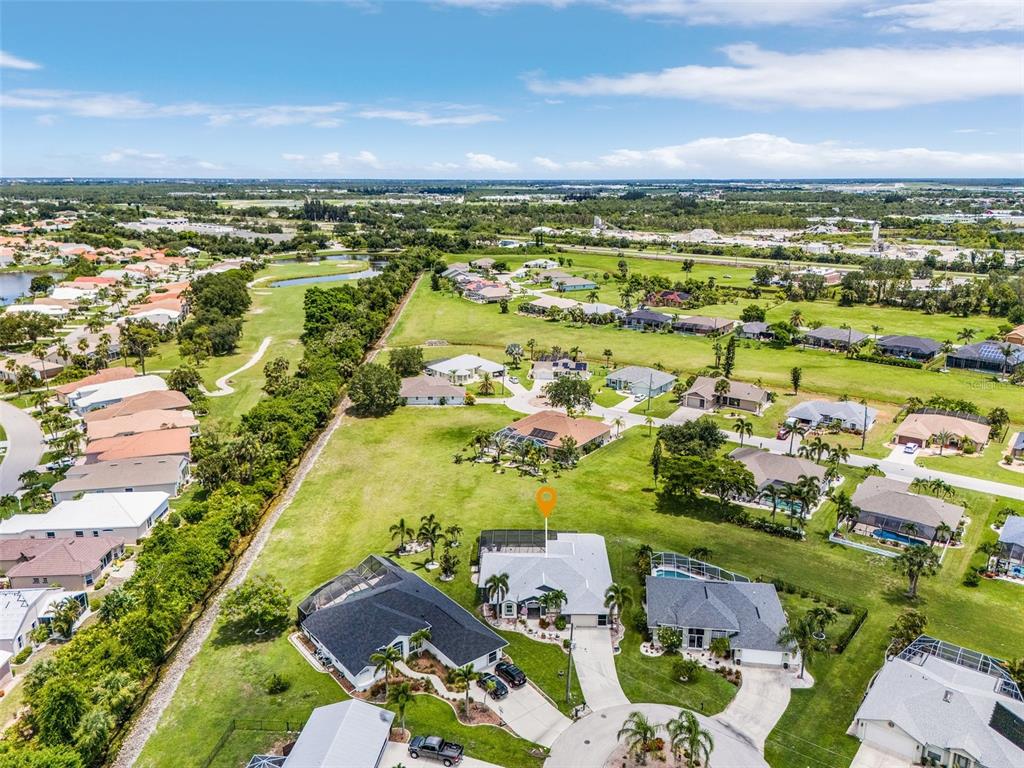 7130 Scarlet Sage Court Punta Gorda, FL 33955 - Photo 24 of 26 an aerial view of residential houses with outdoor space