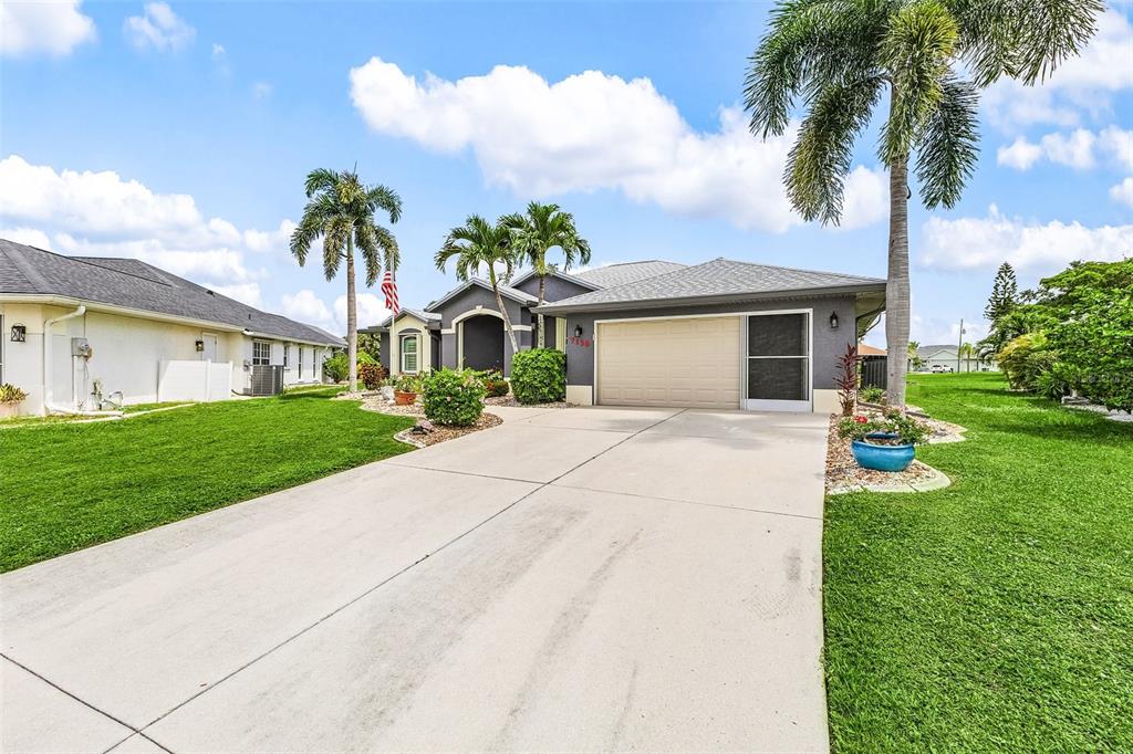 7130 Scarlet Sage Court Punta Gorda, FL 33955 - Photo 3 of 26 a front view of house with yard and green space