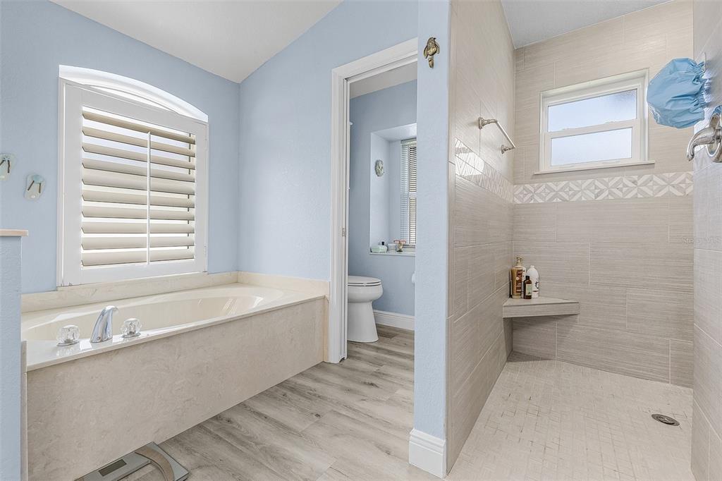 7130 Scarlet Sage Court Punta Gorda, FL 33955 - Photo 9 of 26 a bathroom with a bathtub sink and toilet