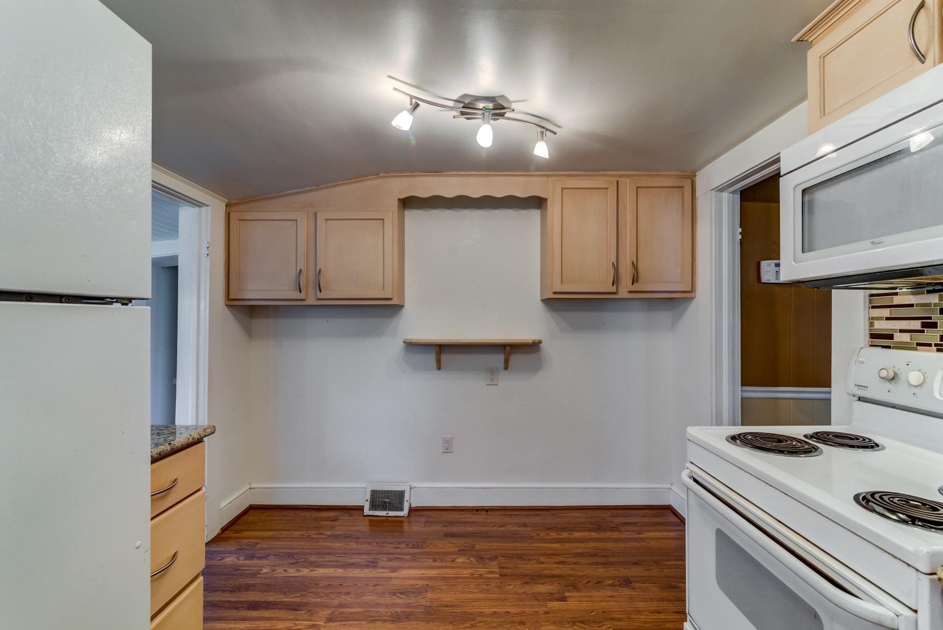 4541 Cowman Road Roanoke, VA 24014 - Photo 11 of 23 a kitchen with a stove and a refrigerator