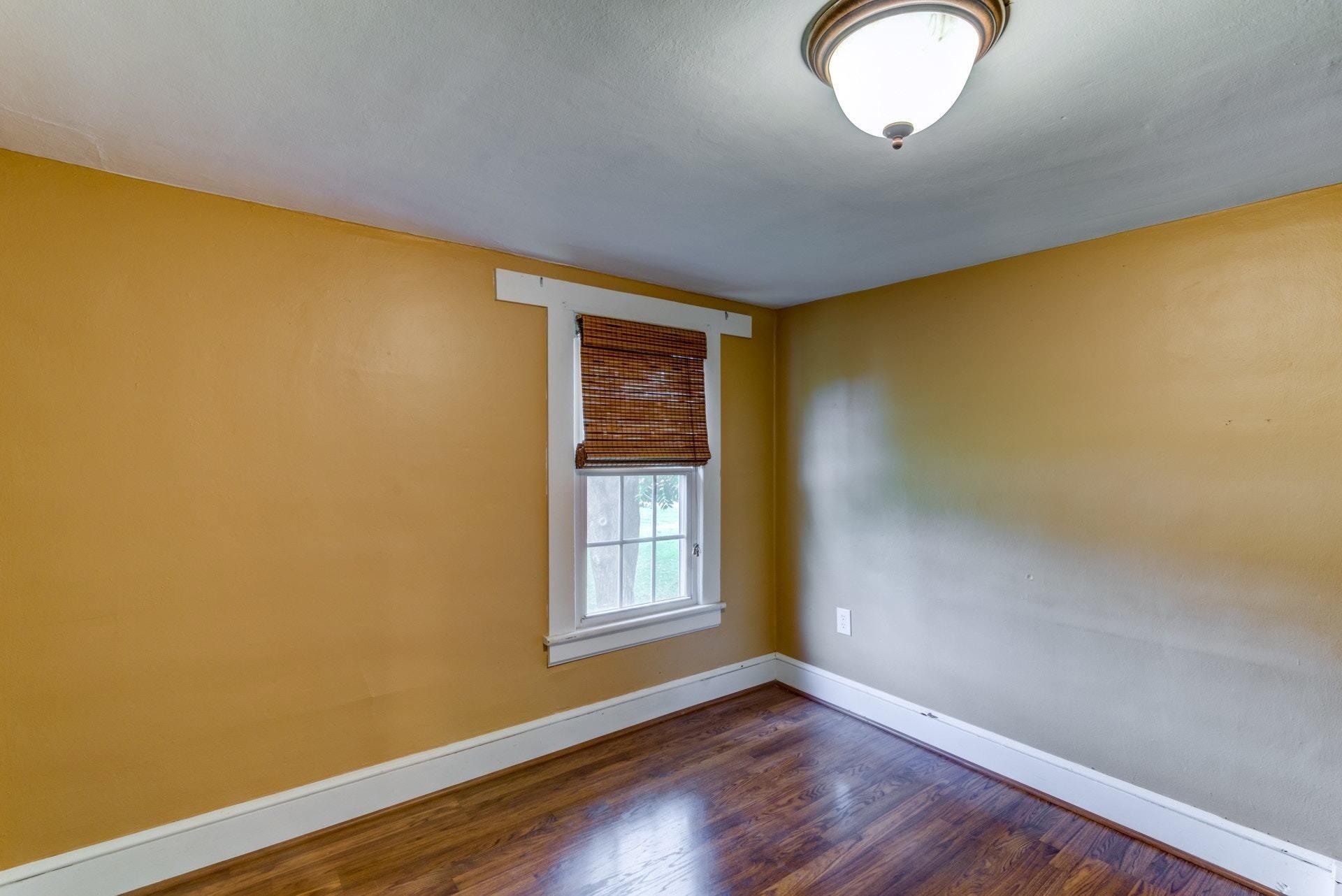 4541 Cowman Road Roanoke, VA 24014 - Photo 14 of 23 an empty room with wooden floor and windows