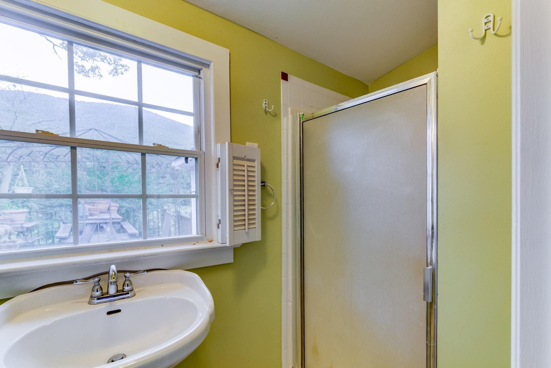 4541 Cowman Road Roanoke, VA 24014 - Photo 20 of 23 a bathroom with a sink and a mirror