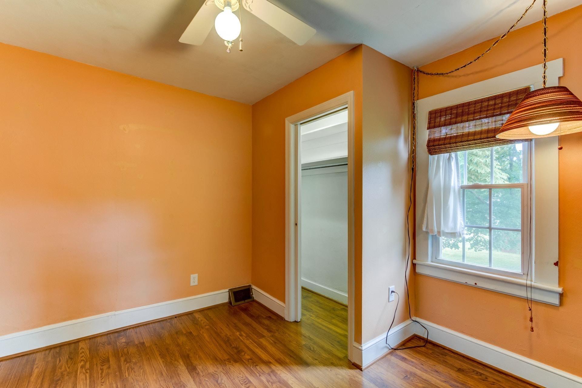 4541 Cowman Road Roanoke, VA 24014 - Photo 5 of 23 an empty room with wooden floor and windows
