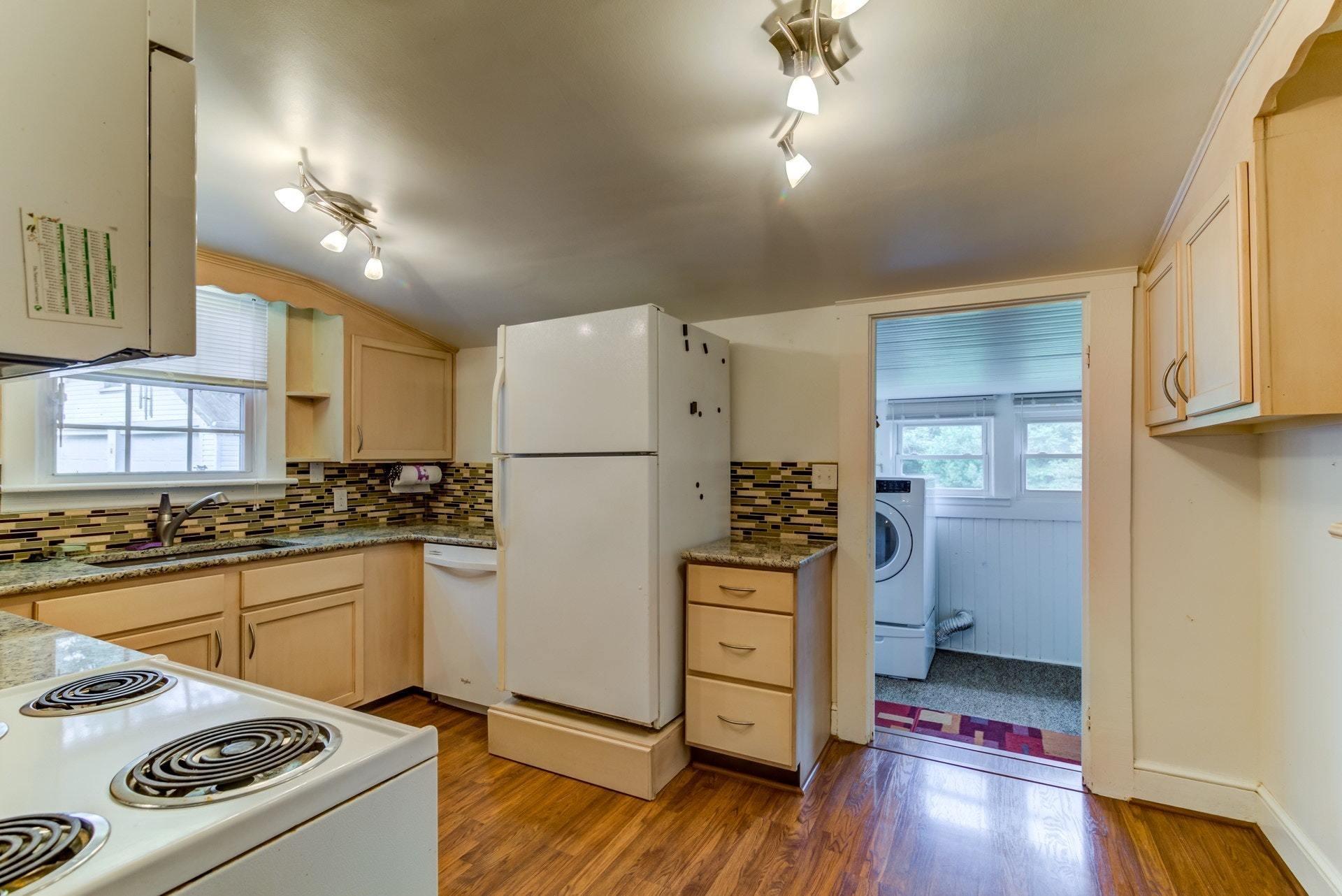 4541 Cowman Road Roanoke, VA 24014 - Photo 7 of 23 a kitchen with a refrigerator and a stove