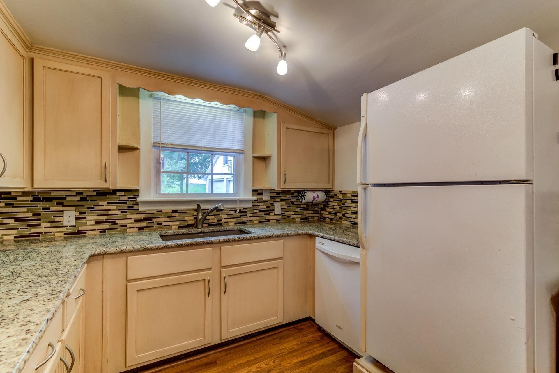 4541 Cowman Road Roanoke, VA 24014 - Photo 10 of 23 a kitchen with a sink and refrigerator