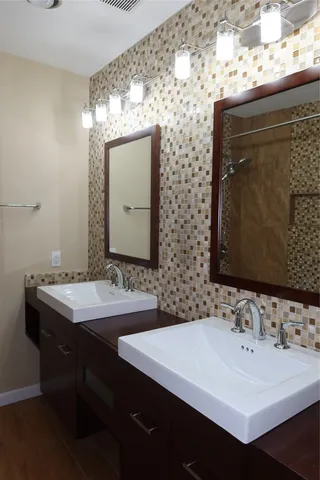 a bathroom with a sink and a mirror