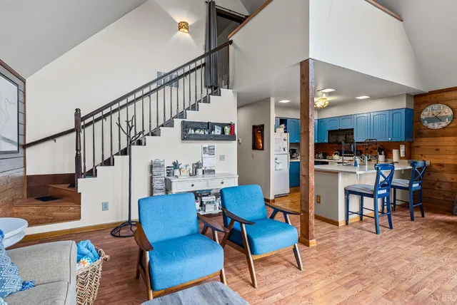a kitchen with a sink a stove and cabinets