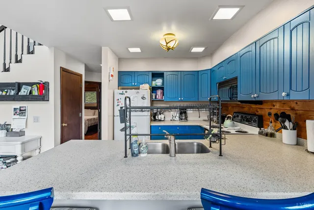 a kitchen with a sink and cabinets