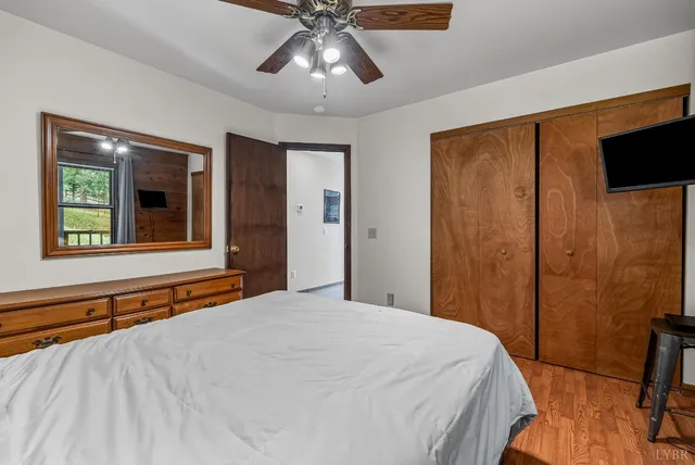 a bedroom with a large bed and a window