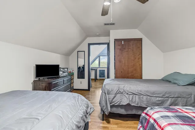 a view of a room with wooden furniture