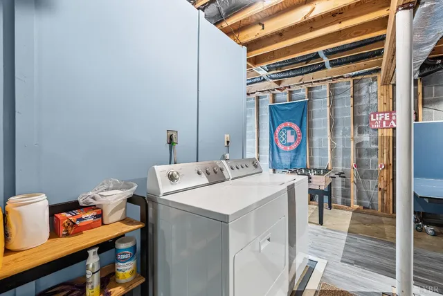 a view of a balcony with wooden floor and outdoor seating